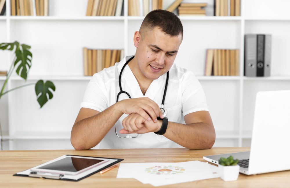 young-doctor-looking-his-watch young-doctor-looking-his-watch